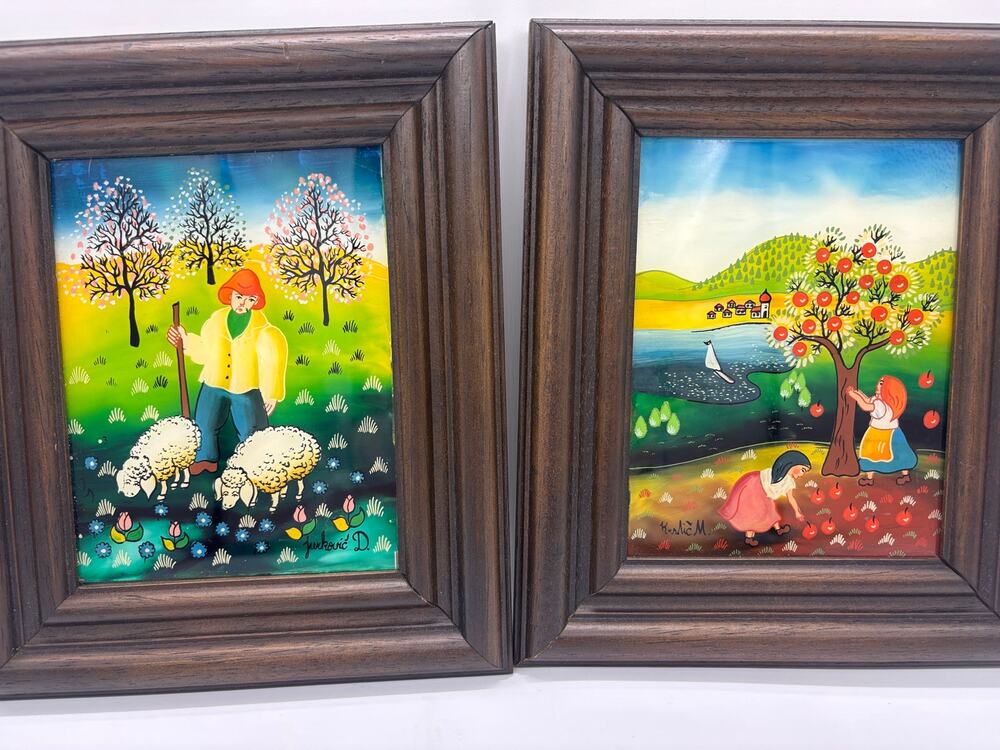 Two naive Eastern European folk art reverse glass paintings. Signed by artists.